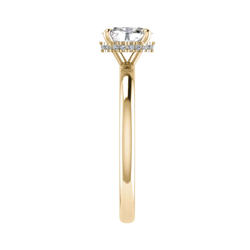 side shot of luxury oval yellow gold hidden halo lab grown diamond engagement ring