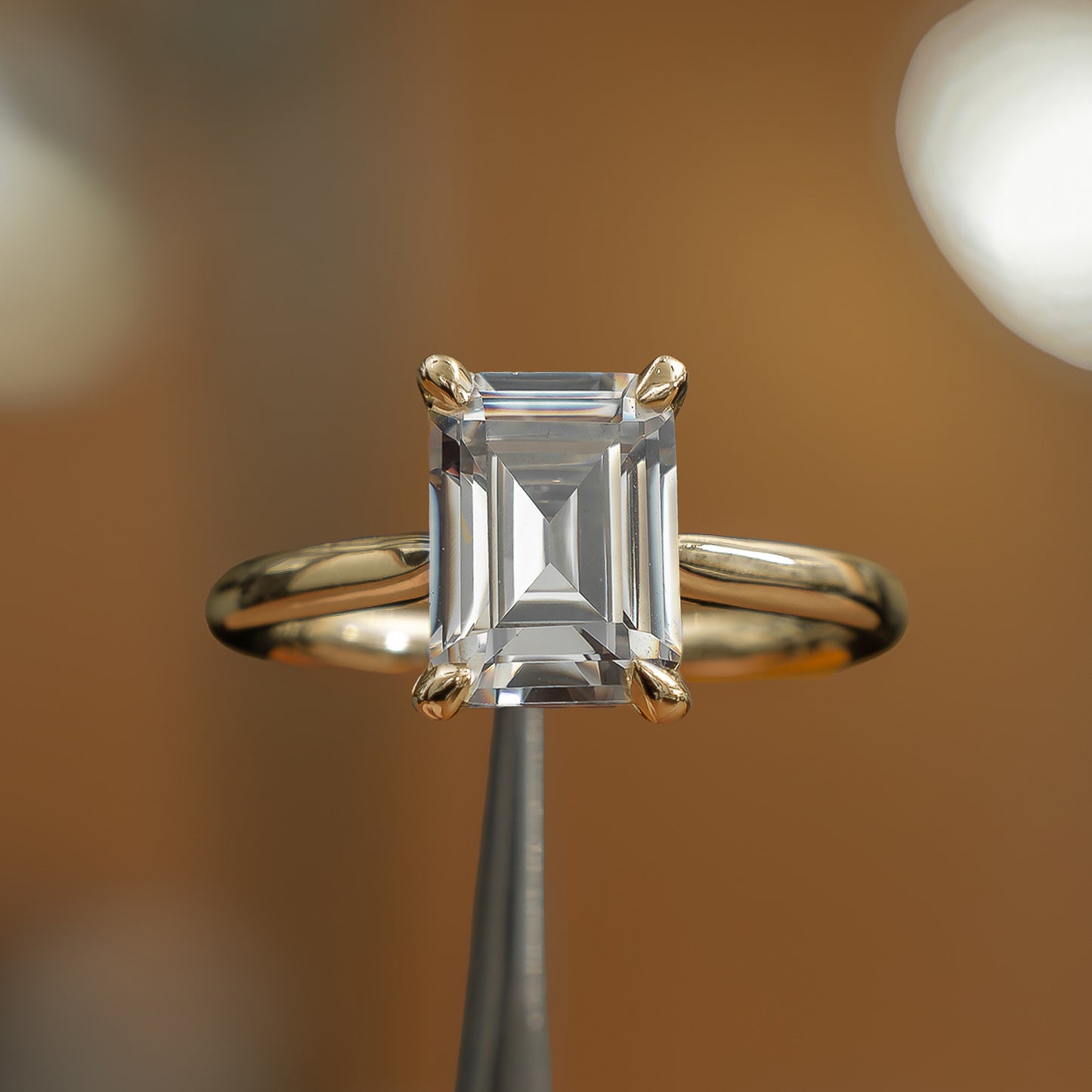 frontal view of emerald yellow gold solitaire lab grown diamond engagement ring