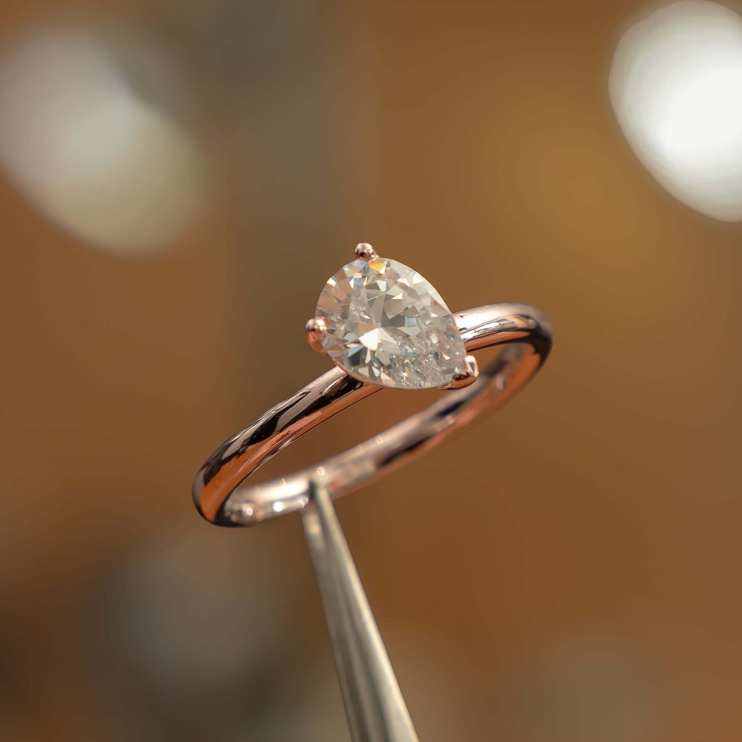 side image in studio luxury pear rose gold solitaire lab grown diamond engagement ring