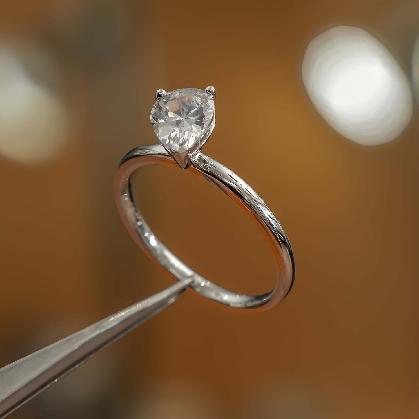 side image in studio luxury pear white gold solitaire lab grown diamond engagement ring