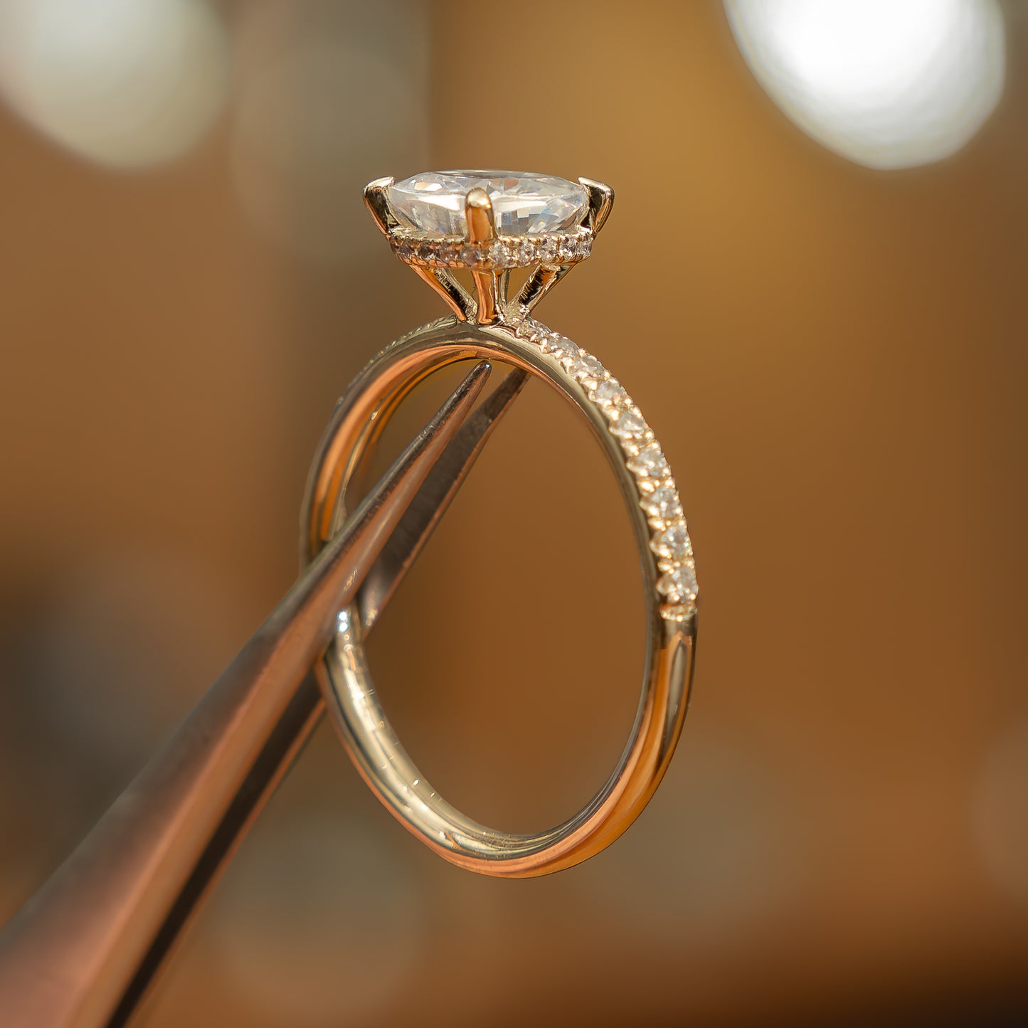 side image of luxury cushion yellow gold diamond set shoulders hidden halo lab grown diamond engagement ring