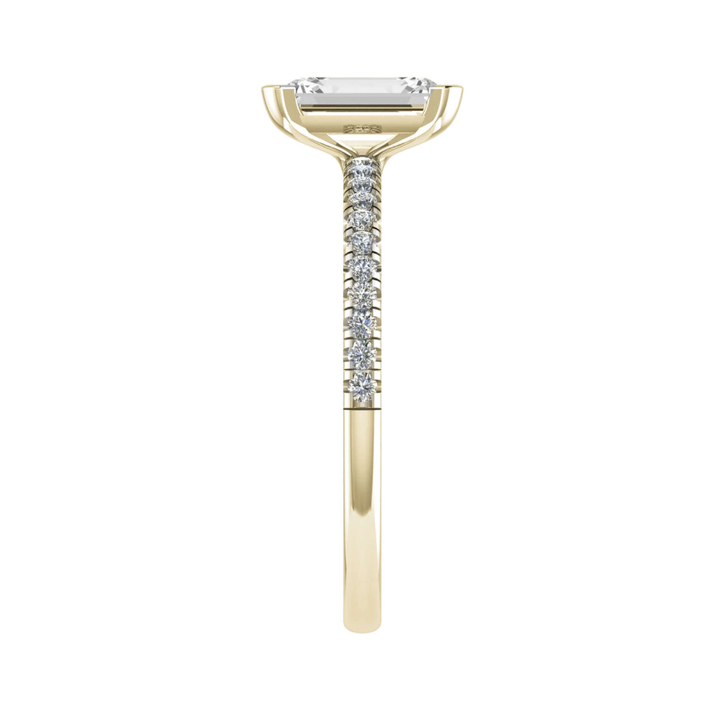 side view of luxury emerald yellow gold diamond set shoulders lab grown diamond engagement ring